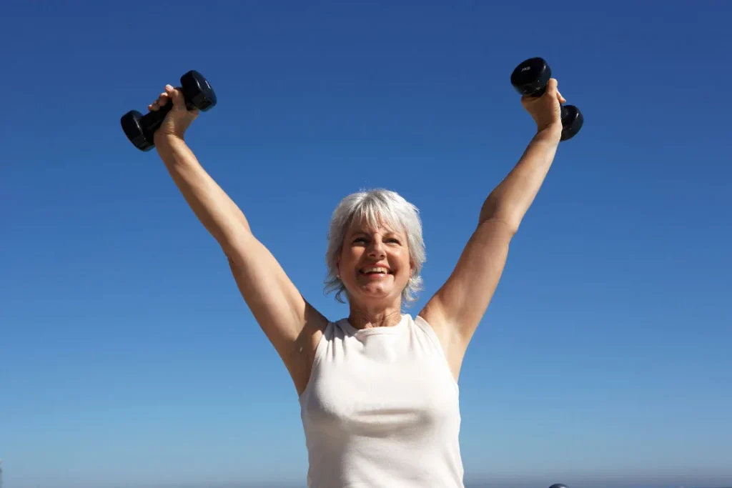 A woman lifting up the bundles. 