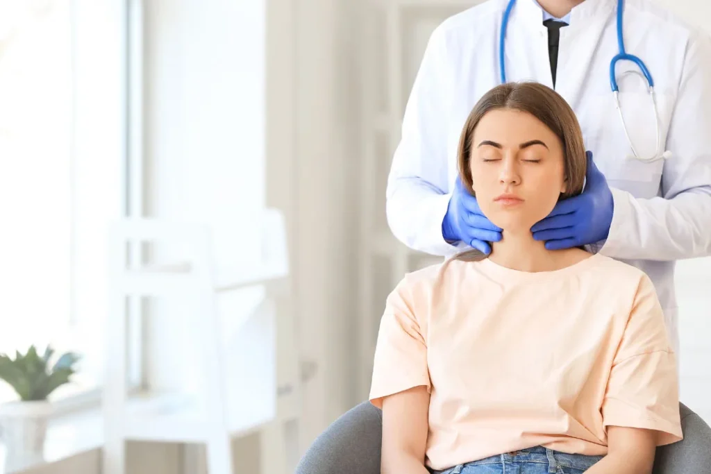 A white girl consulting to the doctor for the thyroid problem. 