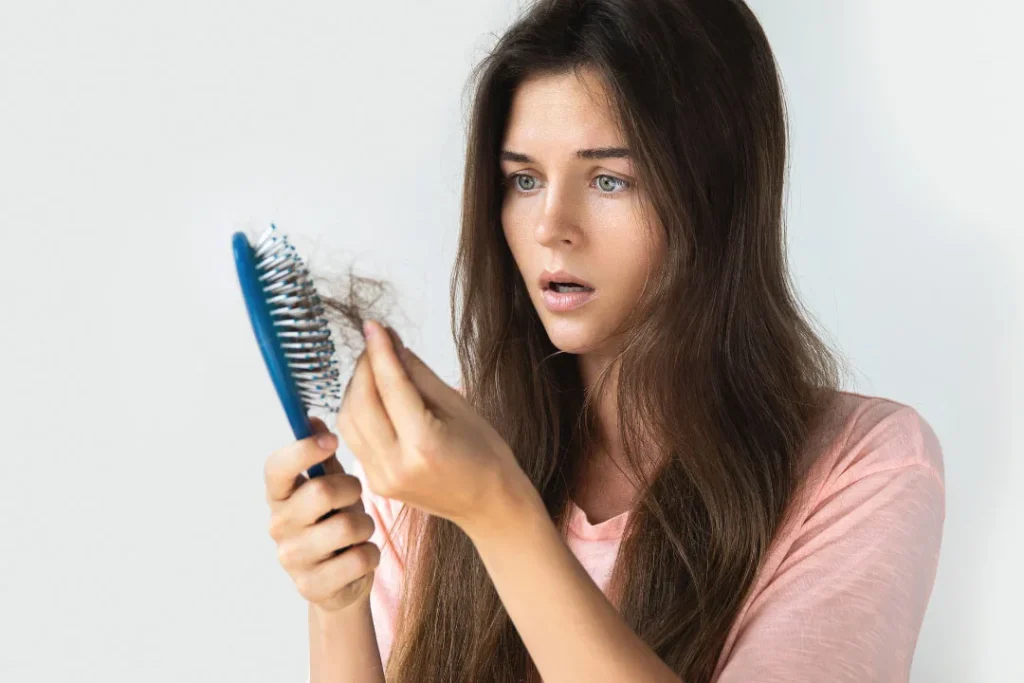 Young lady facing severe hair fall. 