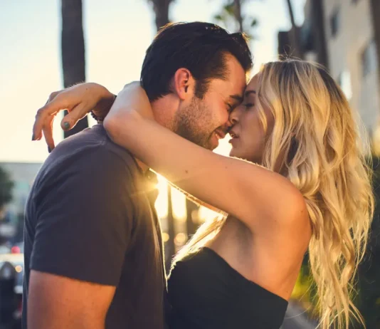 Olly’s Lovin Libido Pills vs Medicine Man Plant Co.’s The Libido Pill Man and woman kissing outdoor.