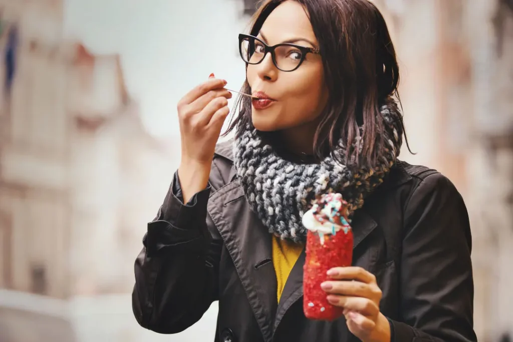 A woman eating ice cream. 