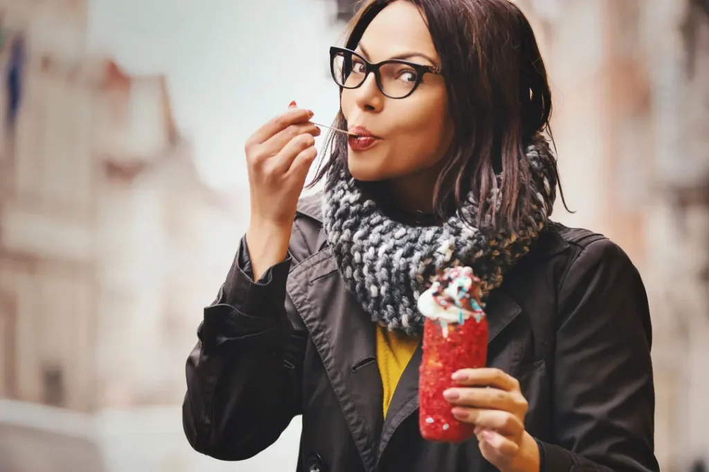 A woman eating ice cream.