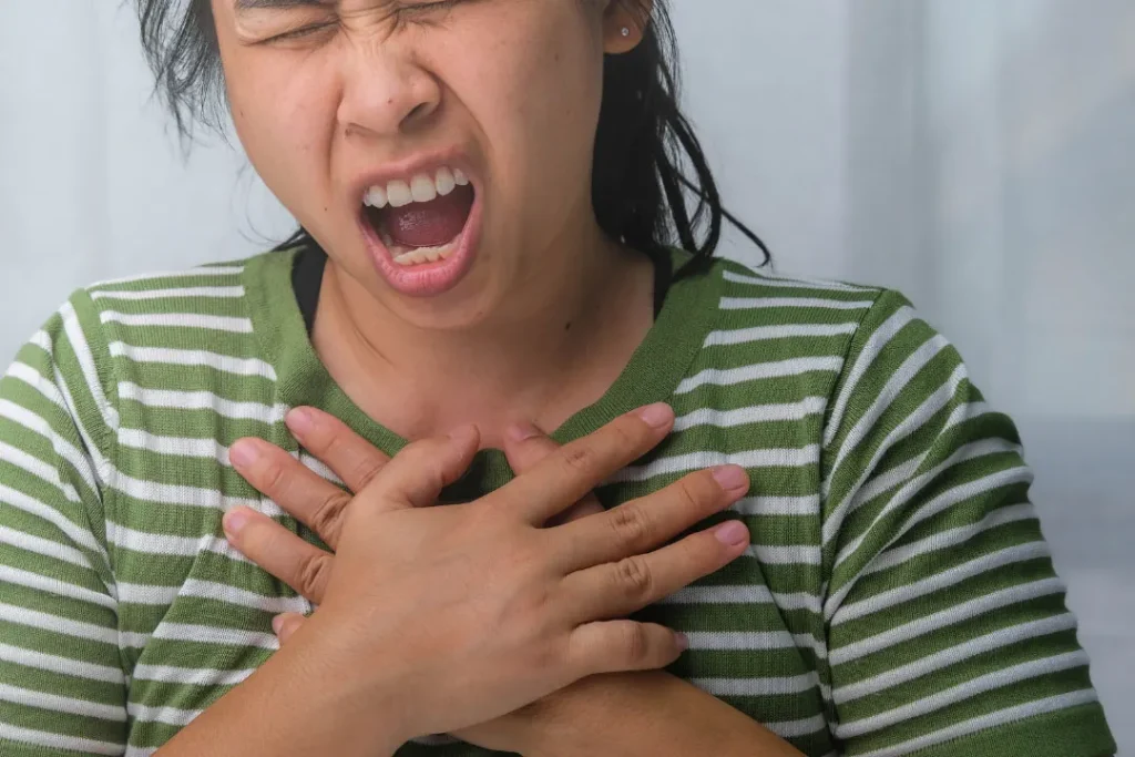 A lady having pain in chest portion. 