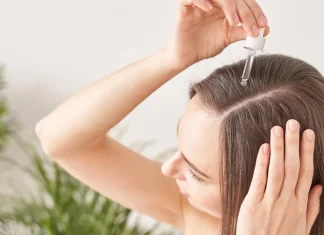 Look Younger with Moringa Oil for Hair: SVA Organics Moringa Oil vs. Green Virgin Products Moringa Oil Girl applying moringa oil in her scalp