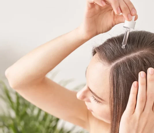 Look Younger with Moringa Oil for Hair: SVA Organics Moringa Oil vs. Green Virgin Products Moringa Oil Girl applying moringa oil in her scalp
